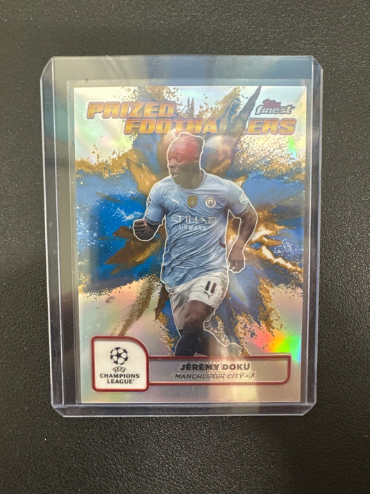 2025 Topps Finest UCC Jeremy Doku Prized Footballers Blue/Gold Fusions SSP